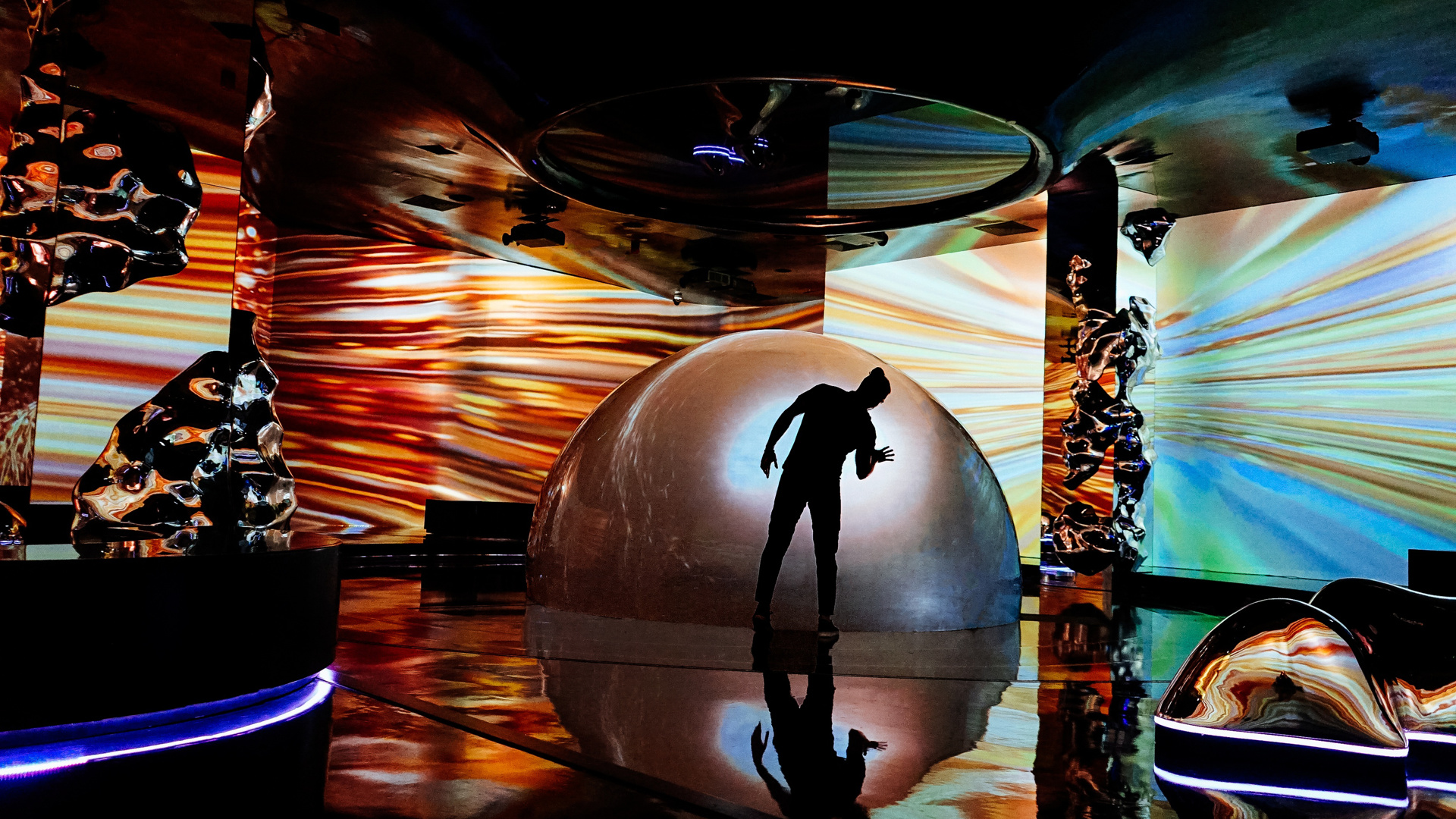 Visitors exploring immersive projections inside a dome
